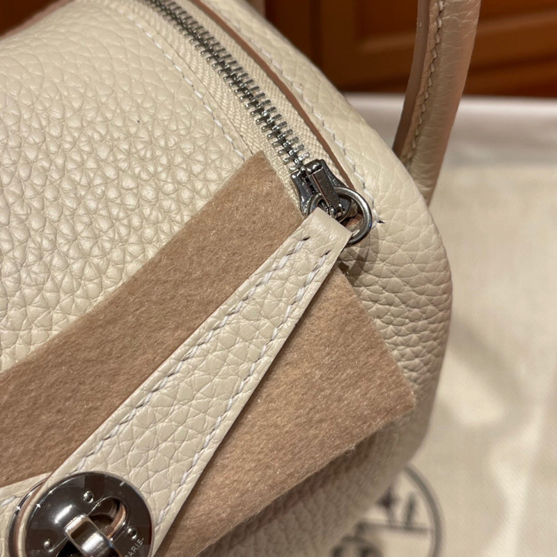 Side view of poised structured handbag
