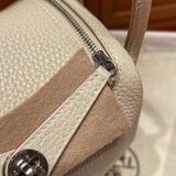 Side view of poised structured handbag