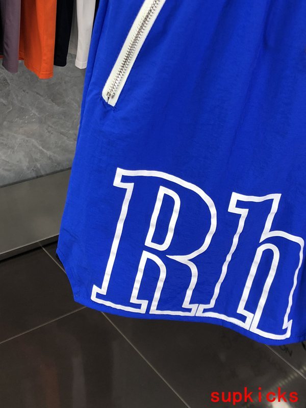 Flat lay presentation of Rhude luxury clothing with logo-detail design