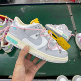 Side profile of Nike crisp white sneakers retro runner design
