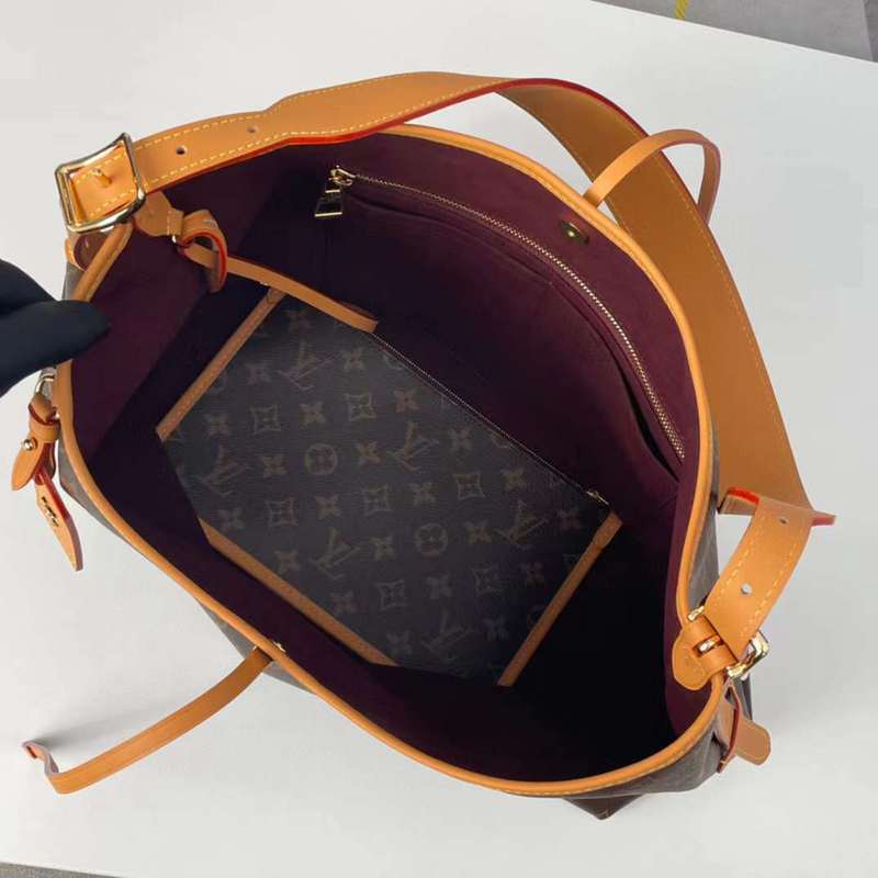 Handle and strap detail of polished chic women's handbag – women's luxury handbag