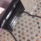 Handle and strap detail of polished statement women's handbag – women's everyday handbag