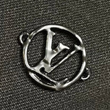 Close-up detail shot of Louis Vuitton luxury clothing with signature branding