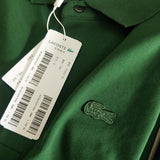 Side profile of Lacoste luxury clothing with signature branding