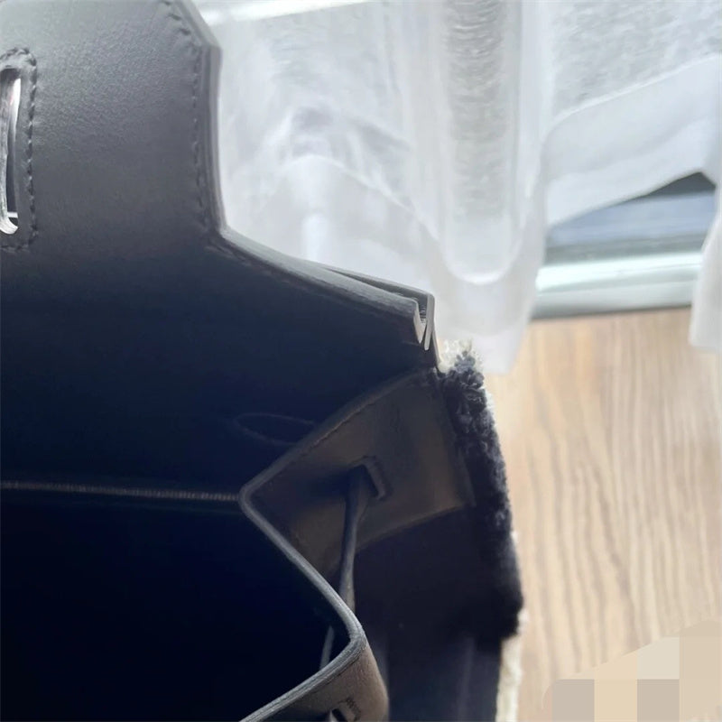 Side view of fluid structured handbag