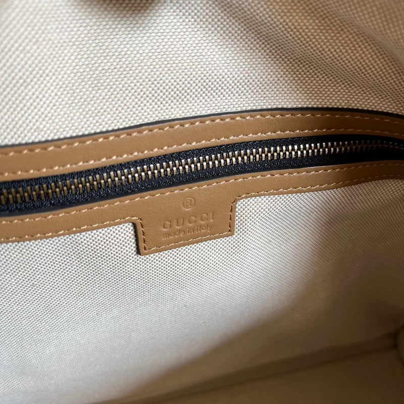 Side view of timeless structured handbag