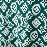Flat lay presentation of Louis Vuitton cotton t-shirt with monogram-inspired silhouette