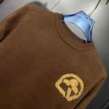 Flat lay presentation of Louis Vuitton luxury clothing with streetwear-inspired cut