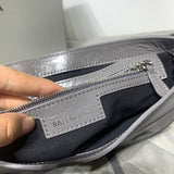 Zivas Charm Sleek Silhouette Statement Handbag (Signature Shape & Finish) – Close-Up Detail