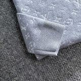 Side profile of Louis Vuitton luxury clothing with logo-detail design