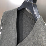 Front view of Louis Vuitton luxury clothing with signature branding