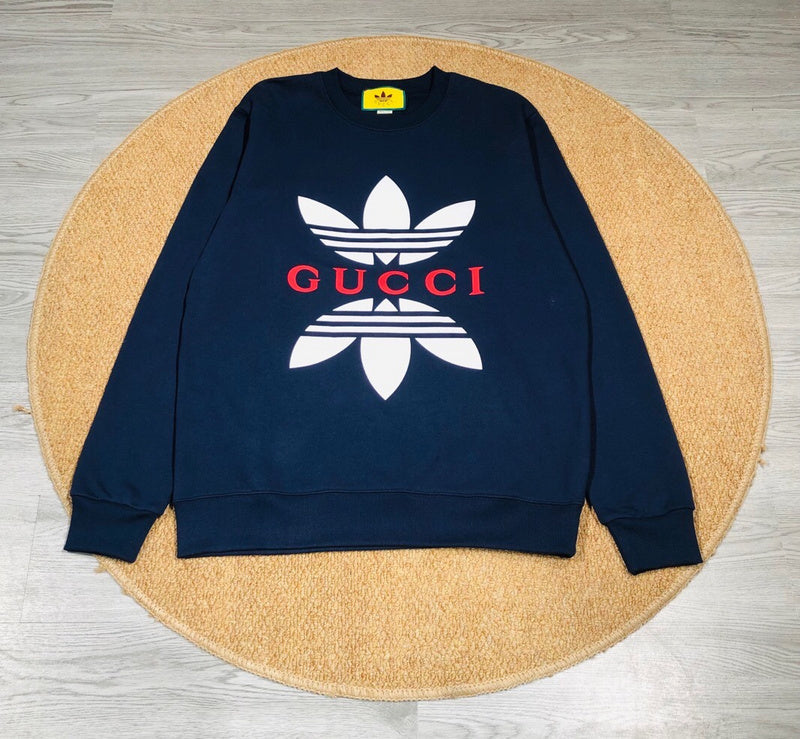 Close-up detail shot of Gucci luxury clothing with monogram-inspired silhouette