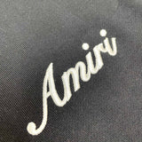 Three-quarter angle view of Amiri luxury piece style No.010