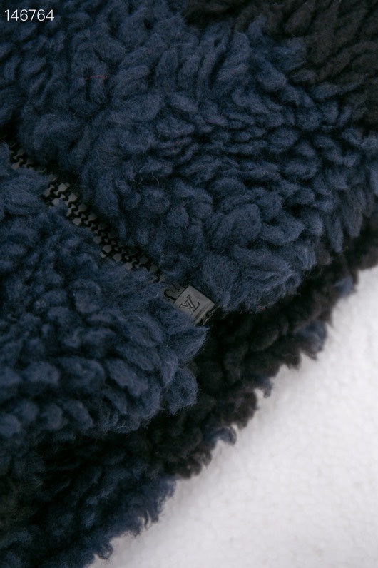 Close-up detail shot of Louis Vuitton luxury clothing with relaxed-fit cut