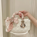 Front view of elevated modern women's handbag – women's luxury accessory
