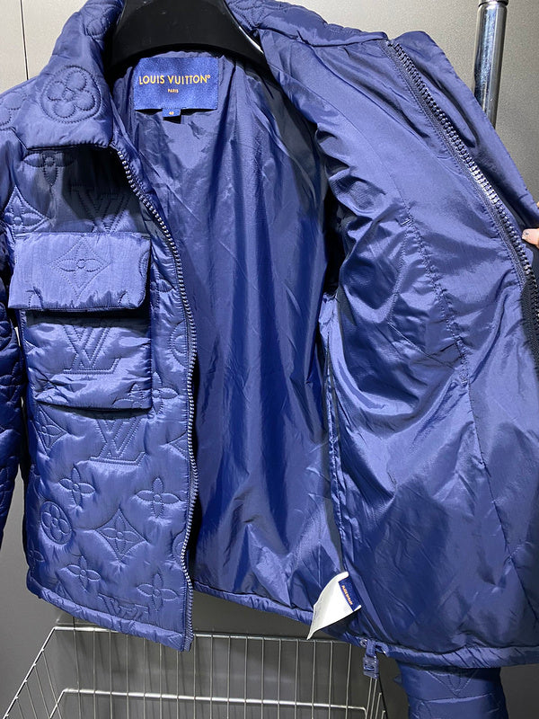 Close-up detail shot of Louis Vuitton luxury clothing with label-forward styling