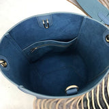 Handle and strap detail of classic statement women's handbag – women's everyday handbag