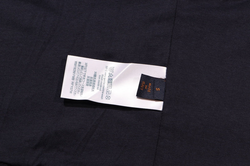 Side profile of Louis Vuitton luxury clothing with label-forward styling