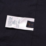Side profile of Louis Vuitton luxury clothing with label-forward styling