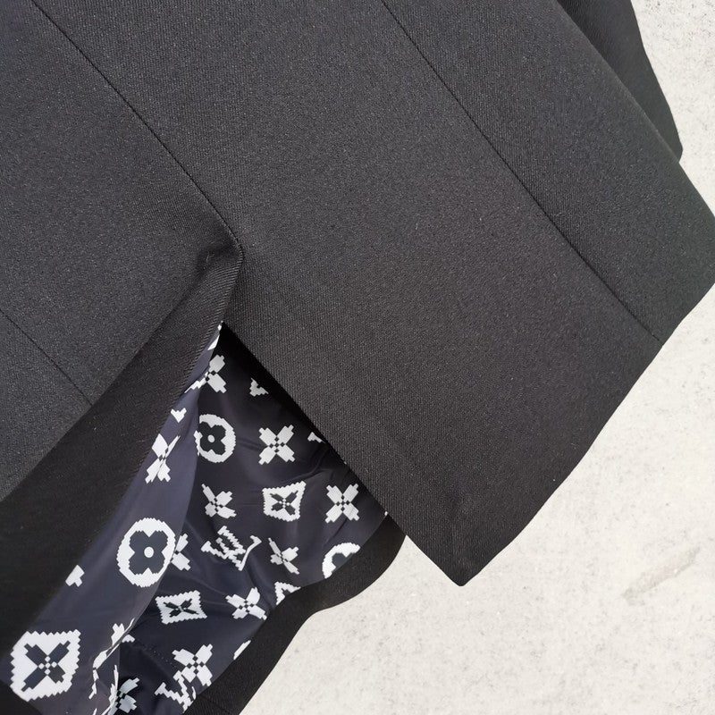 Side profile of Louis Vuitton luxury clothing with logo-detail design