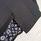 Side profile of Louis Vuitton luxury clothing with logo-detail design