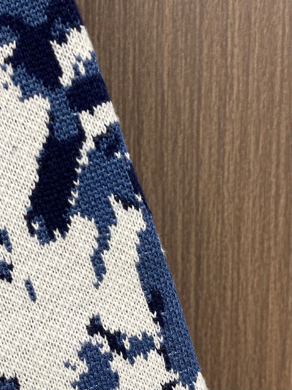 Side profile of Louis Vuitton luxury clothing with monogram-inspired silhouette