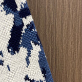 Side profile of Louis Vuitton luxury clothing with monogram-inspired silhouette