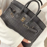Side view of considered structured handbag
