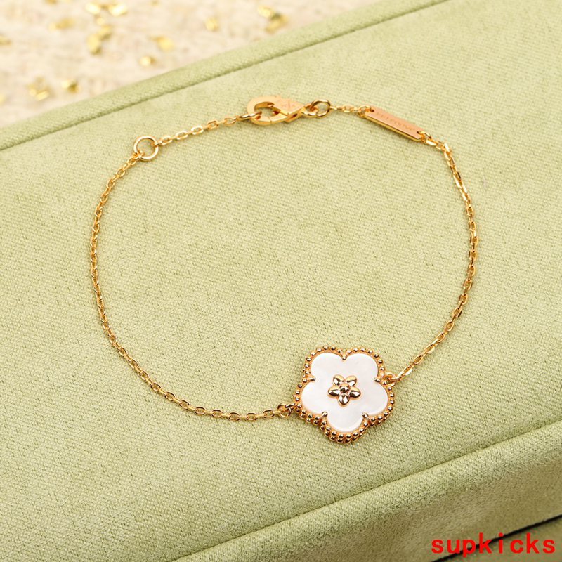 Lifestyle view of Van Cleef & Arpels unisex jewelry piece