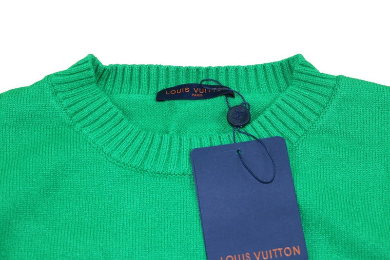 Close-up detail shot of Louis Vuitton luxury clothing with logo-detail design