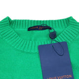 Close-up detail shot of Louis Vuitton luxury clothing with logo-detail design