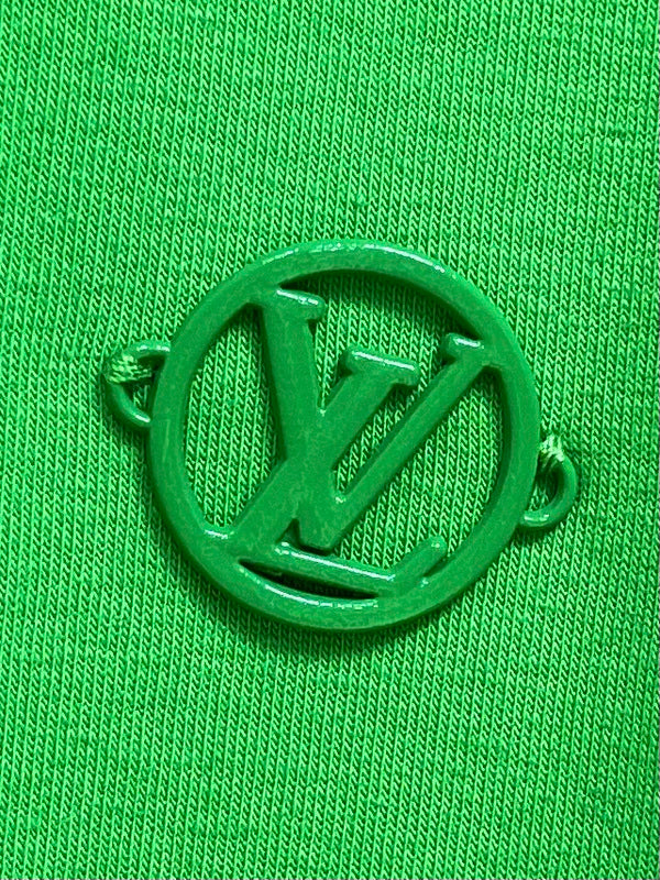 Flat lay presentation of Louis Vuitton luxury clothing with logo-detail design