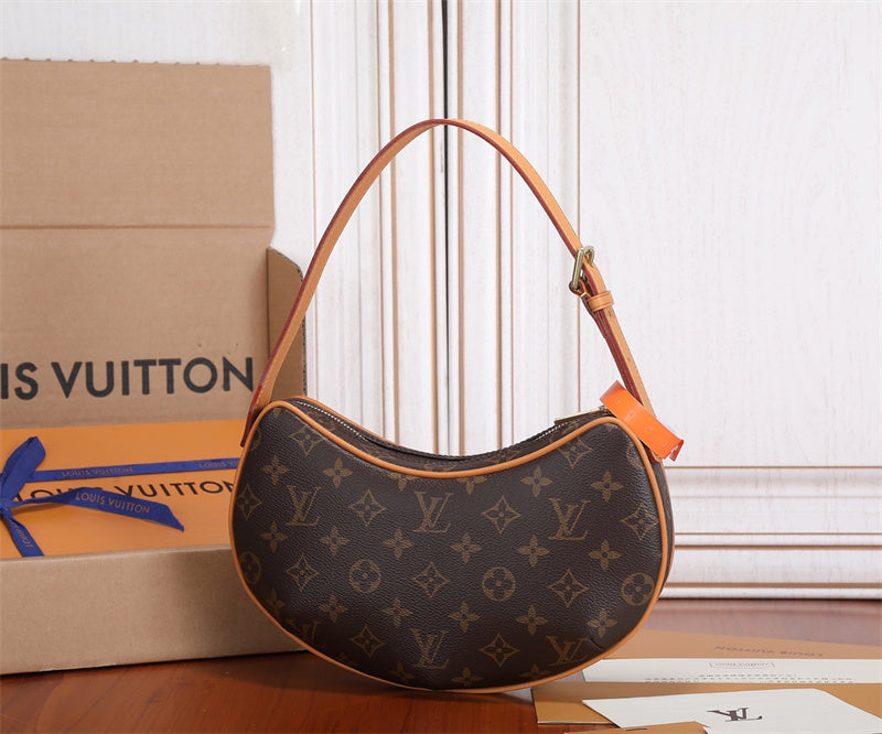  Polished top-handle bag carried on shoulder