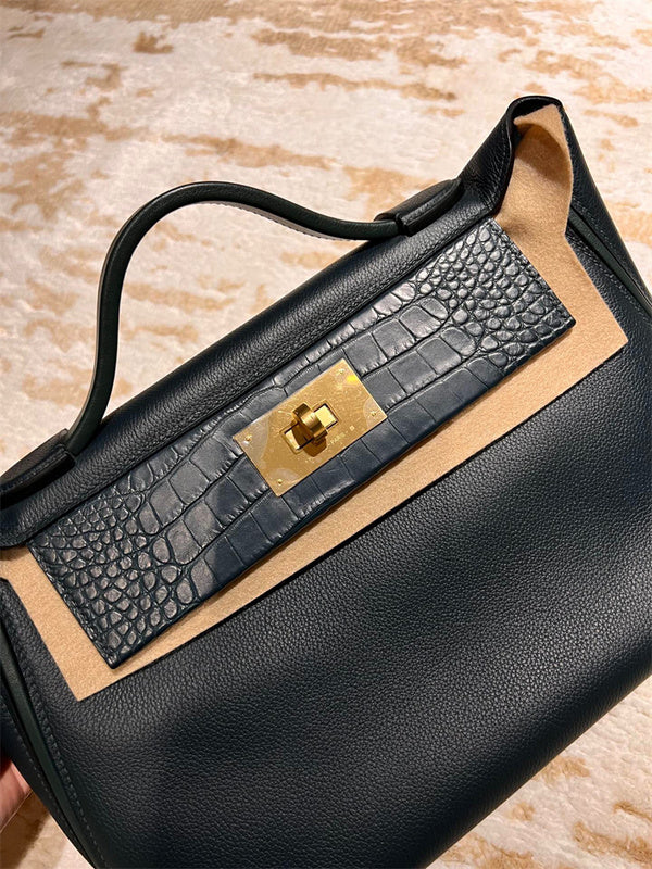 Side view of understated structured handbag