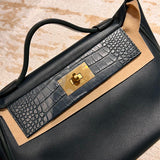 Side view of understated structured handbag