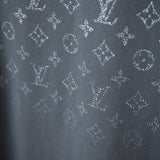 Flat lay presentation of Louis Vuitton cotton t-shirt with signature branding