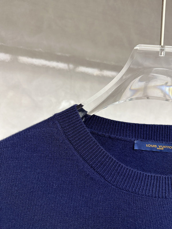 Close-up detail shot of Louis Vuitton luxury clothing with contemporary cut