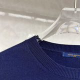 Close-up detail shot of Louis Vuitton luxury clothing with contemporary cut