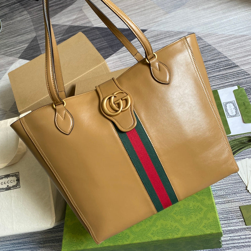Handle and strap detail of modern everyday-luxe women's handbag – women's statement bag
