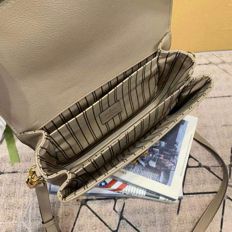 Side profile of classic signature women's handbag – women's luxury accessory