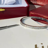 Side view of Cartier unisex jewelry piece