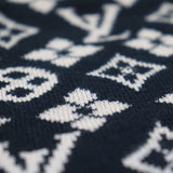 Flat lay presentation of Louis Vuitton luxury clothing with logo-detail design