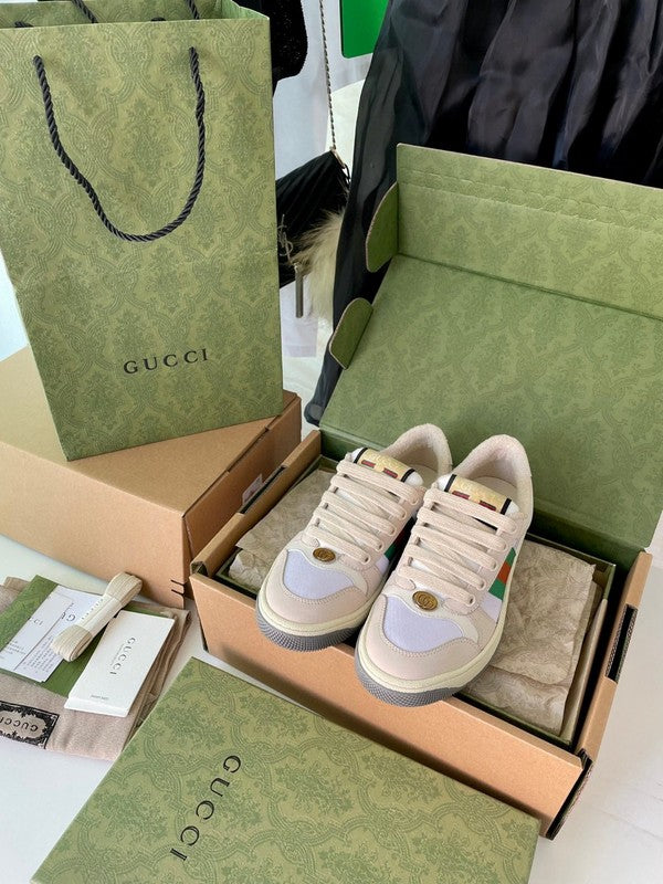 Side profile of Gucci two-tone sneakers signature lace-up style