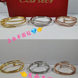 Side view of Cartier unisex jewelry piece