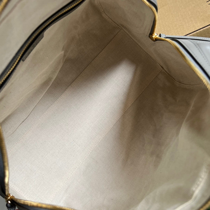 Close-up detail of elevated polished women's handbag – women's designer-style accessory