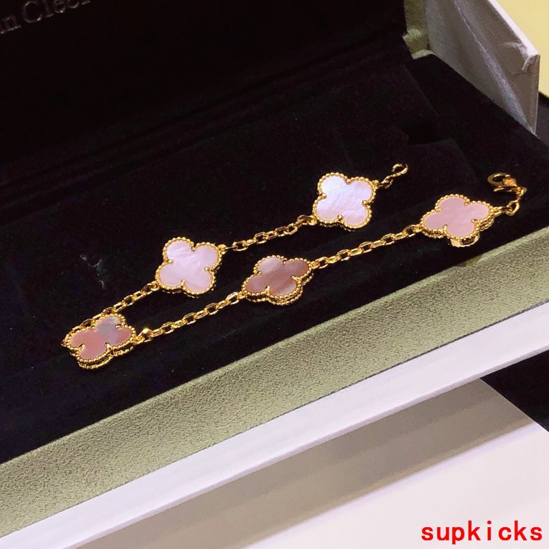 Lifestyle view of Van Cleef & Arpels unisex jewelry piece