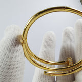 Side view of Cartier unisex jewelry piece