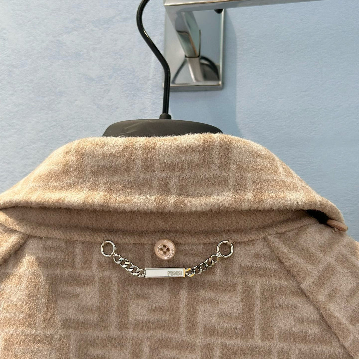 Front view of Fendi premium Coat with iconic logo hardware