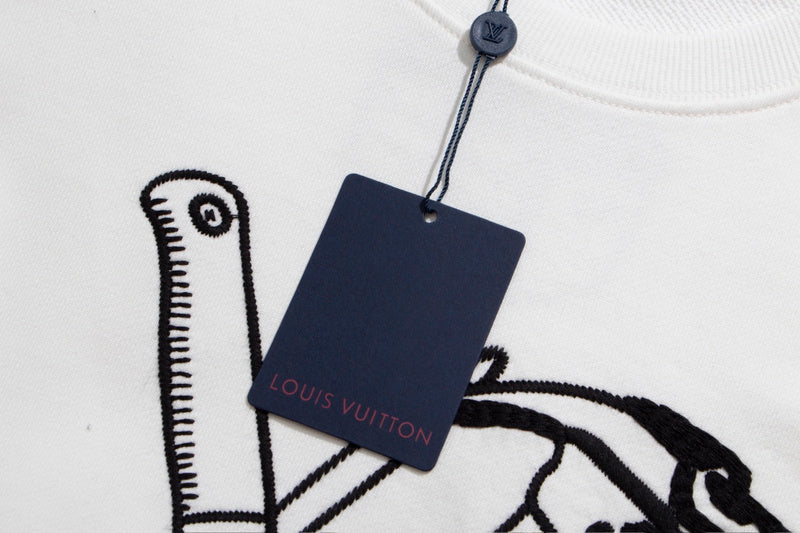 Close-up detail shot of Louis Vuitton luxury clothing with signature branding