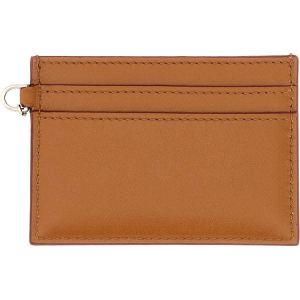 Close-up of Alexander McQueen wallets hardware and fine stitching